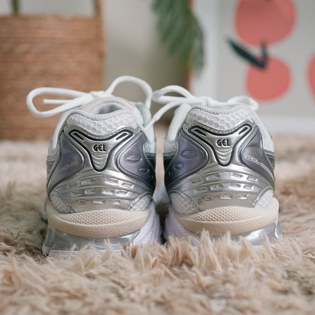 ASICS GEL-Kayano 14 Women’s — in-hand view highlighting Tiger Stripes and midsole